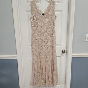 Sleeveless, V-neck, Lace Gown with Sequin Embellishments and a Pleated Hem